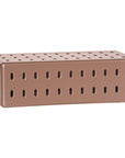 Niche coffee table in penny finish with rectangular form and perforated detailing across the surface and sides.