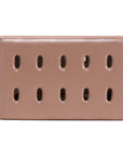 Niche coffee table in penny finish with rectangular form and perforated detailing across the surface and sides.
