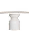 Nuru dining table in eggshell finish with round stone top and sculptural pedestal base isolated on a light background
