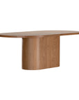 Contemporary oak dining table featuring a sleek rounded design with a solid cylindrical base, perfect for modern interiors
