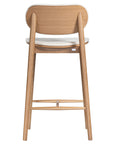 A contemporary bar stool featuring a natural oak frame with a curved white upholstered seat and backrest, designed for modern kitchens and dining spaces