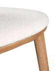 A contemporary bar stool featuring a natural oak frame with a curved white upholstered seat and backrest, designed for modern kitchens and dining spaces