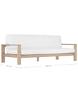 Kulala Living's Outdoor Teak Sofa with white cushions, crafted from natural solid teak wood. Designed for durability and comfort, this contemporary outdoor lounge piece seamlessly blends with modern coastal and relaxed outdoor living spaces