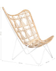 A handcrafted butterfly chair featuring an intricately woven natural rattan seat with a geometric pattern, supported by a sleek white metal frame