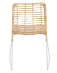 A handwoven rattan dining chair with a white metal frame, featuring an airy, open-weave design. The natural rattan seat and backrest bring an organic touch to contemporary and coastal interiors