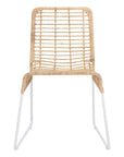 A handwoven rattan dining chair with a white metal frame, featuring an airy, open-weave design. The natural rattan seat and backrest bring an organic touch to contemporary and coastal interiors