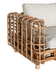 Handcrafted rattan one seater sofa featuring an intricate open-weave frame with plush natural cushions, combining natural texture with contemporary comfort for indoor or covered outdoor spaces