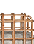 Handcrafted rattan one seater sofa featuring an intricate open-weave frame with plush natural cushions, combining natural texture with contemporary comfort for indoor or covered outdoor spaces