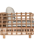 Handcrafted rattan one seater sofa featuring an intricate open-weave frame with plush natural cushions, combining natural texture with contemporary comfort for indoor or covered outdoor spaces