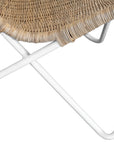 A stylish rattan sling chair with a white metal frame, featuring an airy woven seat and a relaxed silhouette, perfect for modern coastal and bohemian interiors.