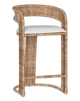 A natural rattan bar stool with a curved backrest and a white upholstered cushion. The woven texture and sturdy frame bring a relaxed yet sophisticated coastal-inspired aesthetic to any bar or kitchen counter