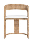 A natural rattan dining chair with a curved backrest and a white upholstered cushion. The woven design and sturdy frame create a stylish and comfortable seating option, perfect for modern coastal or relaxed interiors