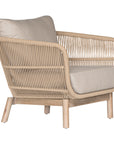 A stylish rope weave armchair with a natural wood frame and soft linen cushions. Designed for both indoor and outdoor use, this chair offers a relaxed, contemporary aesthetic perfect for modern and coastal-inspired interiors