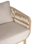 A stylish rope weave armchair with a natural wood frame and soft linen cushions. Designed for both indoor and outdoor use, this chair offers a relaxed, contemporary aesthetic perfect for modern and coastal-inspired interiors