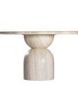 Round sculptural dining table crafted from natural travertine stone, featuring a smooth circular top and a rounded pedestal base. Elegant and timeless design ideal for contemporary and refined dining spaces.