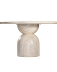 Round sculptural dining table crafted from natural travertine stone, featuring a smooth circular top and a rounded pedestal base. Elegant and timeless design ideal for contemporary and refined dining spaces.