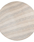 Round sculptural dining table crafted from natural travertine stone, featuring a smooth circular top and a rounded pedestal base. Elegant and timeless design ideal for contemporary and refined dining spaces.