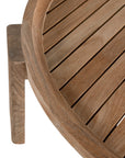 The Kulala Living Round Teak Coffee Table, crafted from solid teak with a slatted tabletop and sturdy block legs. This timeless design adds warmth and natural texture to any living space.