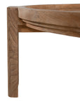 The Kulala Living Round Teak Coffee Table, crafted from solid teak with a slatted tabletop and sturdy block legs. This timeless design adds warmth and natural texture to any living space.