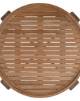 The Kulala Living Round Teak Coffee Table, crafted from solid teak with a slatted tabletop and sturdy block legs. This timeless design adds warmth and natural texture to any living space.