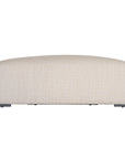 Curved upholstered ottoman with natural textured fabric and subtle black feet, ideal for contemporary living spaces
