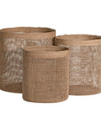 Set of three natural jute storage baskets with open weave design, perfect for stylish organisation and coastal decor.