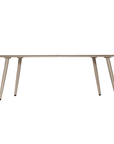 Solara coffee table with organic curved shape and light finish on a clean studio background.