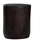 A solid timber stool with a smooth black finish, featuring a minimalist cylindrical design. Ideal as a side table or additional seating for modern and organic interiors