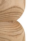 A sculptural solid timber stool with a curved silhouette, showcasing natural wood grain patterns. Versatile as a side table or additional seating, perfect for organic and modern interiors