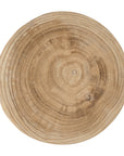 A sculptural solid timber stool with a curved silhouette, showcasing natural wood grain patterns. Versatile as a side table or additional seating, perfect for organic and modern interiors