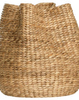 Talura basket set in natural handwoven seagrass with organic rounded shape and softly structured open tops.