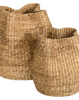 Talura basket set in natural handwoven seagrass with organic rounded shape and softly structured open tops.