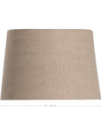 A neutral-toned linen wall light shade with a minimalist curved design. This sophisticated fabric shade brings a soft, warm ambiance to any space, perfect for modern and natural-inspired interiors
