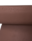 Tarran coffee table in cinnabar clay finish with rounded top and sculptural cylindrical leg