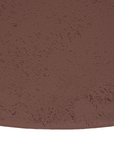 Tarran coffee table in cinnabar clay finish with rounded top and sculptural cylindrical leg