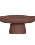 Tarran coffee table in cinnabar clay finish with rounded top and sculptural cylindrical leg