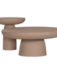 Tarran side table and coffee table in nomad dune with sculptural pedestal base and rounded top shown in a clean minimal setting.