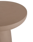 Tarran side table in nomad dune with sculptural pedestal base and rounded top shown in a clean minimal setting.