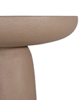 Tarran side table in nomad dune with sculptural pedestal base and rounded top shown in a clean minimal setting.