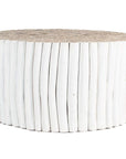 A round coffee table crafted from natural teak branches, arranged in a drum-style design. The organic texture and neutral tones make it a statement piece for coastal and contemporary interiors