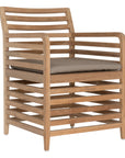 A contemporary teak outdoor dining chair featuring a striking slatted design and a taupe seat cushion for added comfort. Perfect for stylish alfresco dining