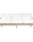Kulala Living three-seater teak sofa with plush white cushions, combining timeless craftsmanship with relaxed elegance. Perfect for contemporary and coastal-inspired interiors