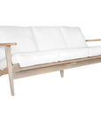 Kulala Living three-seater teak sofa with plush white cushions, combining timeless craftsmanship with relaxed elegance. Perfect for contemporary and coastal-inspired interiors