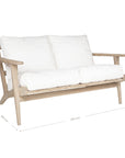 Kulala Living two-seater teak sofa with plush white cushions, combining timeless craftsmanship with relaxed elegance. Perfect for contemporary and coastal-inspired interiors