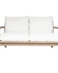Kulala Living two-seater teak sofa with plush white cushions, combining timeless craftsmanship with relaxed elegance. Perfect for contemporary and coastal-inspired interiors