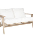 Kulala Living two-seater teak sofa with plush white cushions, combining timeless craftsmanship with relaxed elegance. Perfect for contemporary and coastal-inspired interiors