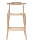 Scandinavian rattan and sungkai bar stool with a minimalist design and curved backrest, perfect for modern interiors