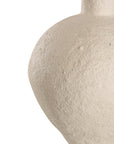 Kulala Living textured paper mache table lamp with a sculptural base and a natural linen shade. A refined lighting piece that adds warmth and organic elegance to any interior setting