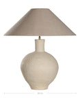 Kulala Living textured paper mache table lamp with a sculptural base and a natural linen shade. A refined lighting piece that adds warmth and organic elegance to any interior setting