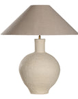 Kulala Living textured paper mache table lamp with a sculptural base and a natural linen shade. A refined lighting piece that adds warmth and organic elegance to any interior setting